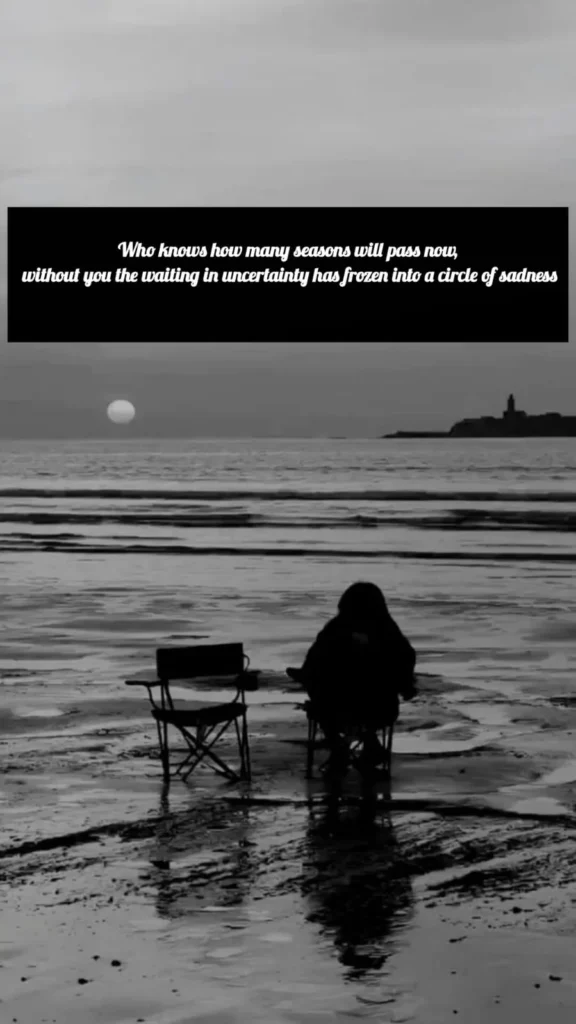 img 4 person sitting alone on beach in black and white sadness