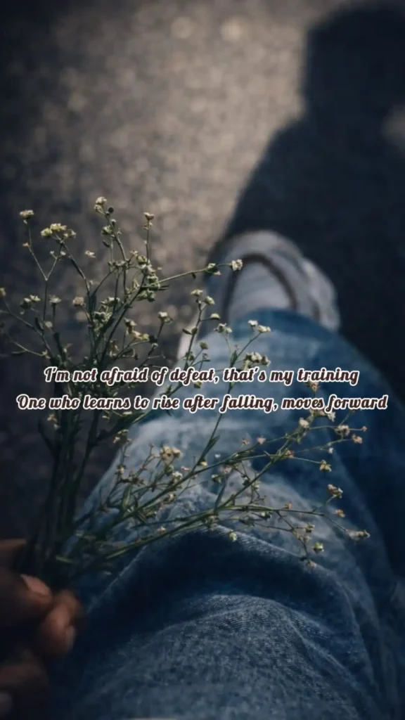 holding flowers not afraid of defeat rise after falling inspirational english poetry