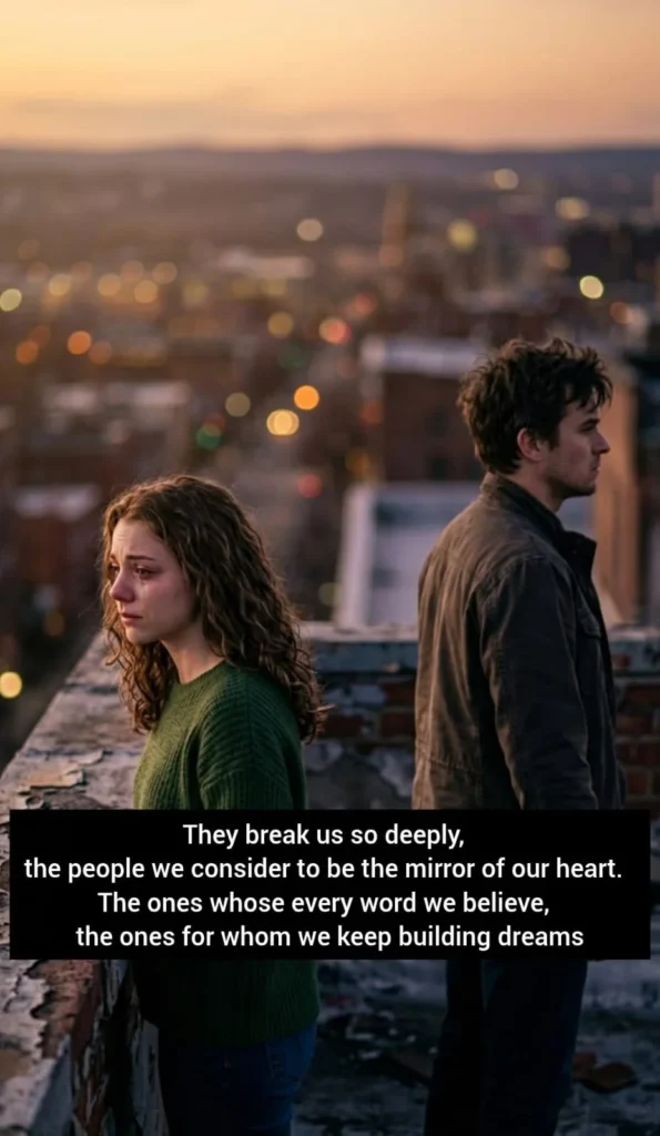 poem about broken trust with a heartbroken couple standing apart on a rooftop at sunset, city lights glowing behind them