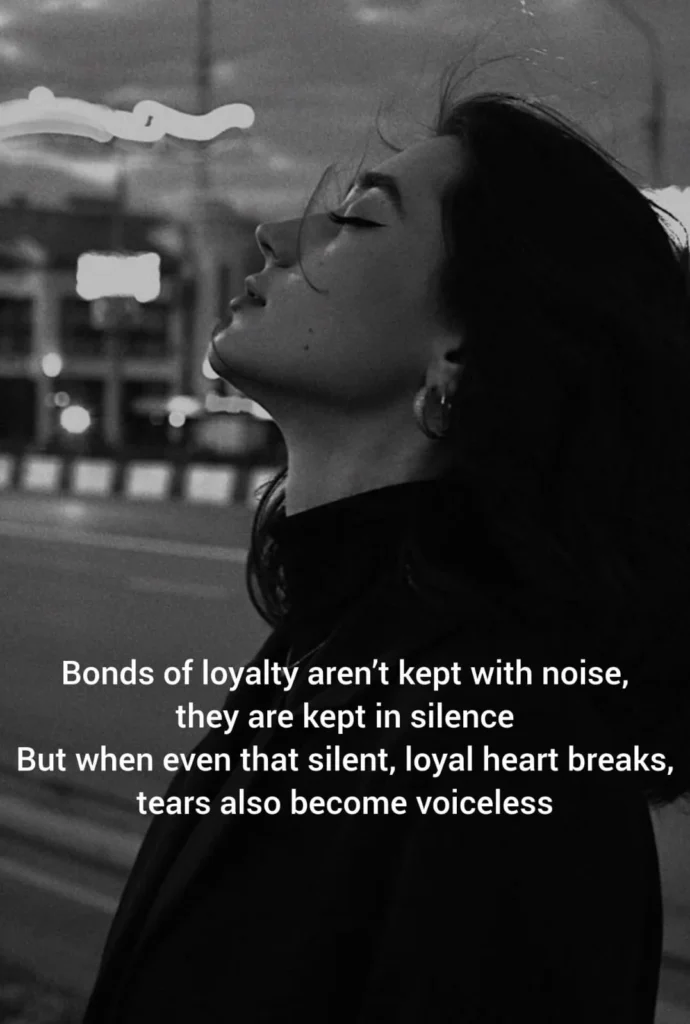 poem about broken trust with a silent woman standing alone, hair blowing in the wind on a quiet black and white city street
