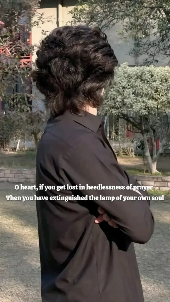 prayer-imam-hussain-poetry-man-turned-away-heedless — English verse warning that heedlessness of prayer extinguishes the soul's own lamp, over a man standing turned away outdoors