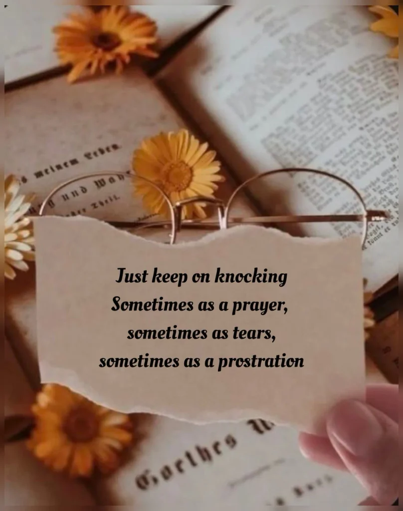 Torn paper note with dua poetry about knocking resting on glasses and yellow flowers