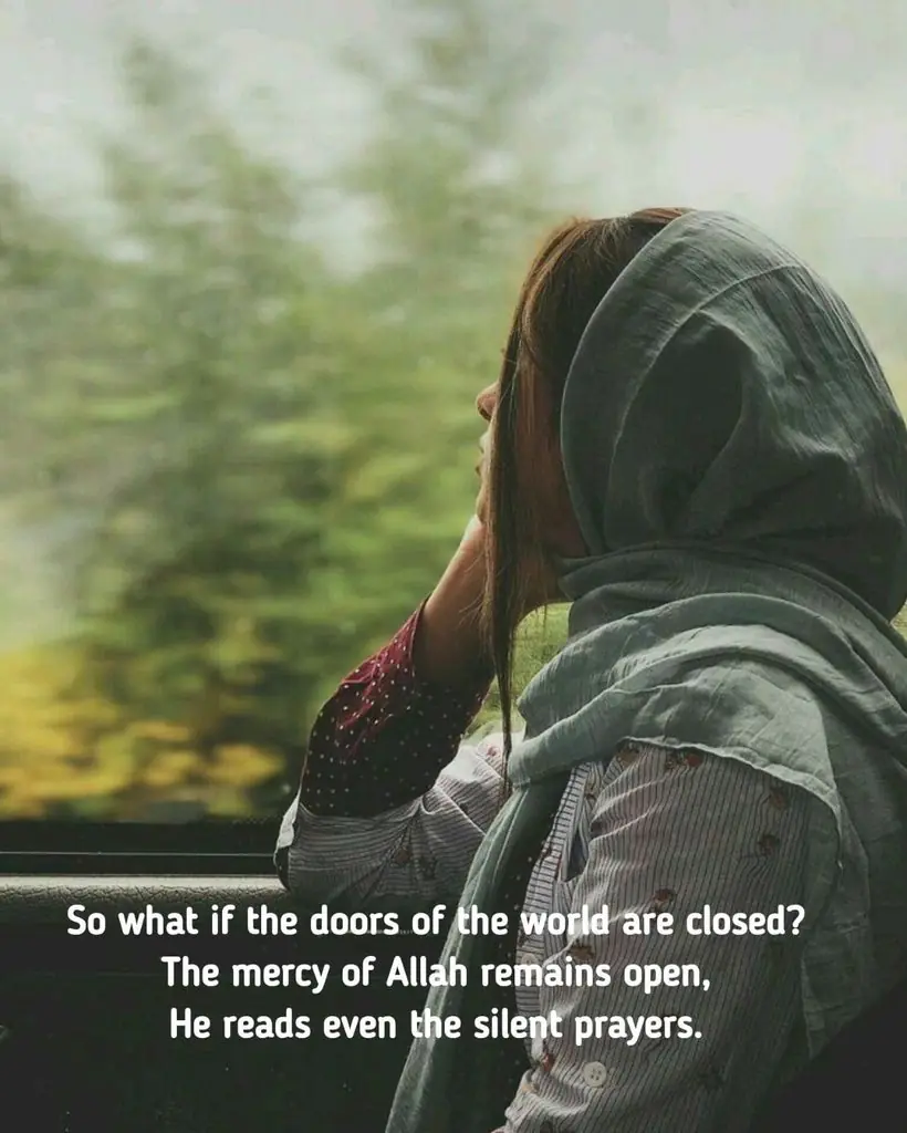 girl-looking-out-window-at-green-trees-allah-mercy-remains-open-poetry-quote-image