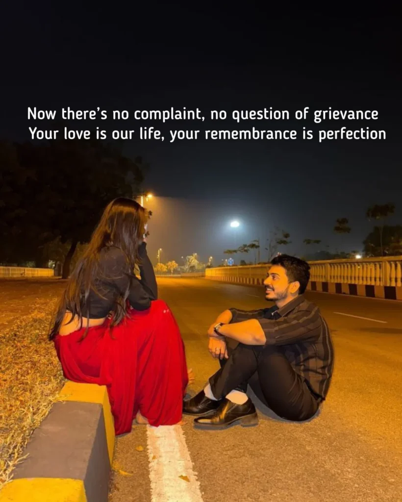 couple sitting together on a quiet road at night, junoon shayari