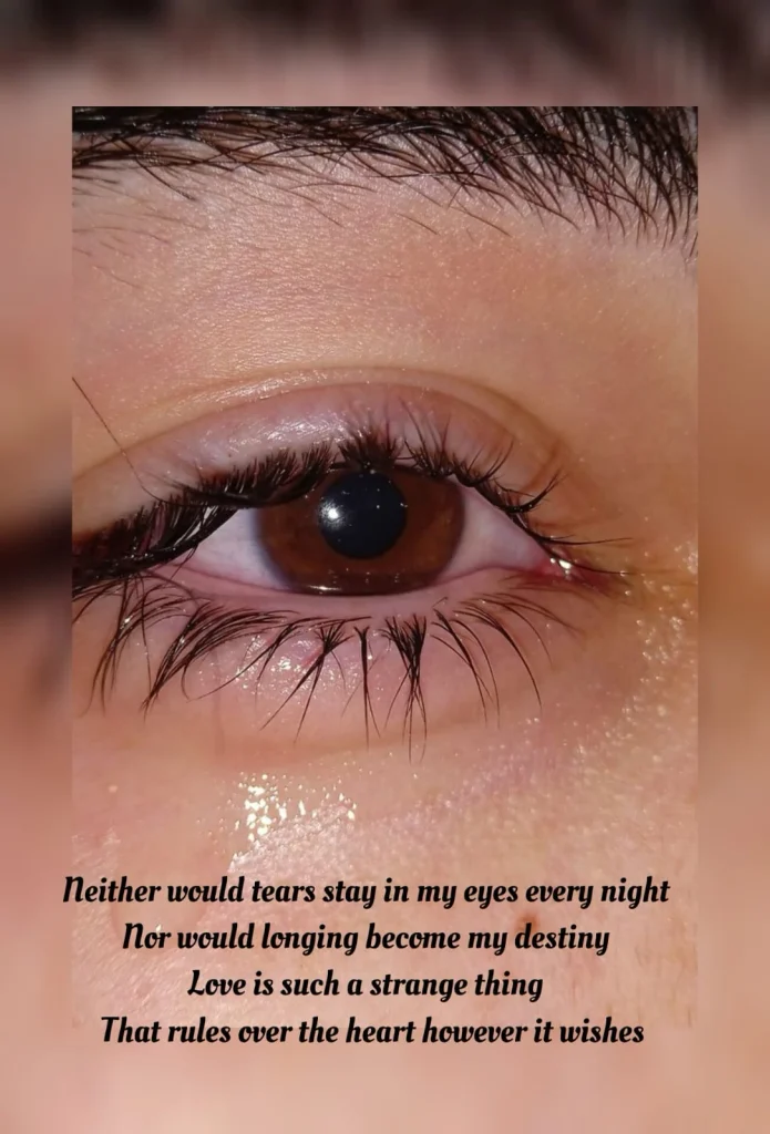 Close up crying eye showing love rules the heart poem